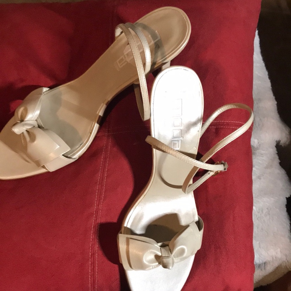 Never worn: Ankle strap pearl cream bow top shoe